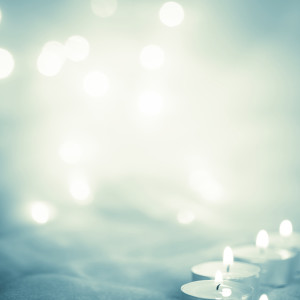 Glowing background with candle lights - Stock Image